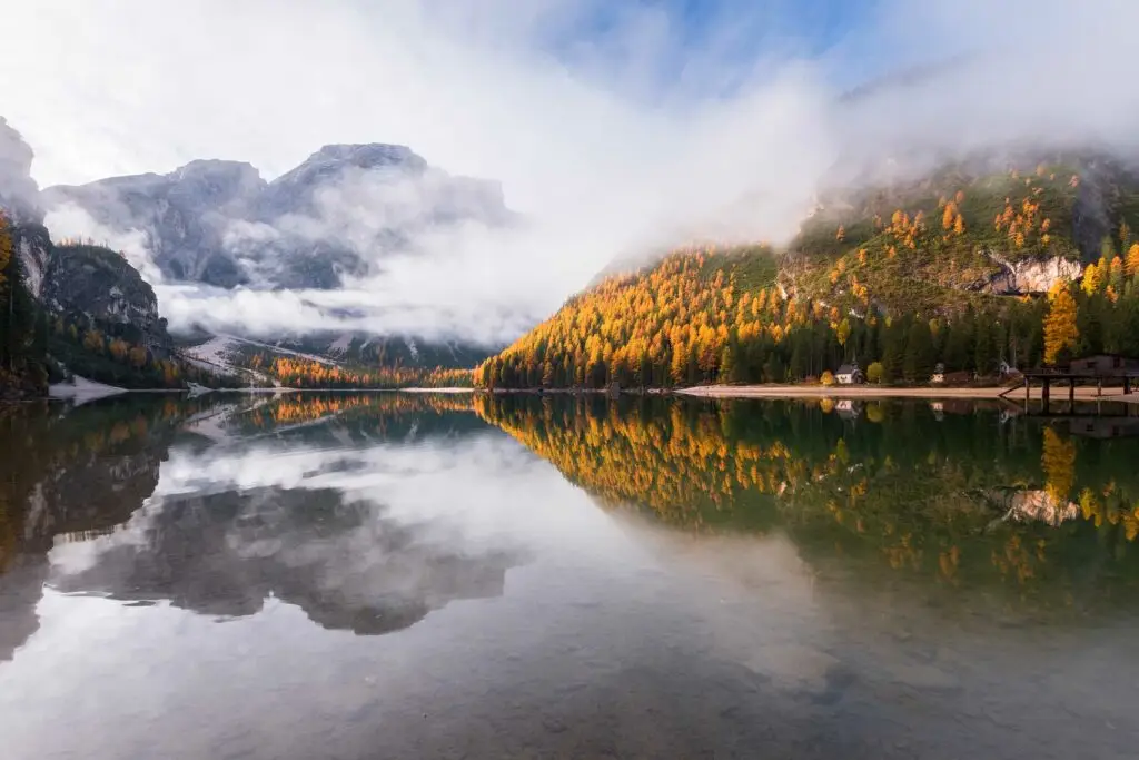 moody autumn day in the dolomites forest and mount 9KNZCFT